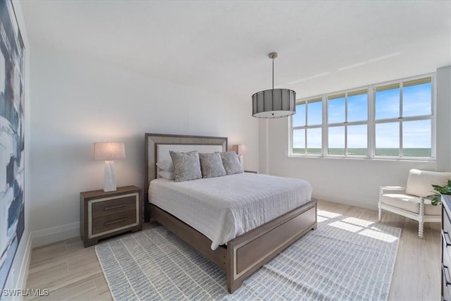 980 Cape Marco Dr Unit 805, Marco Island, FL 34145 - bedroom featuring light wood finished floors and baseboards