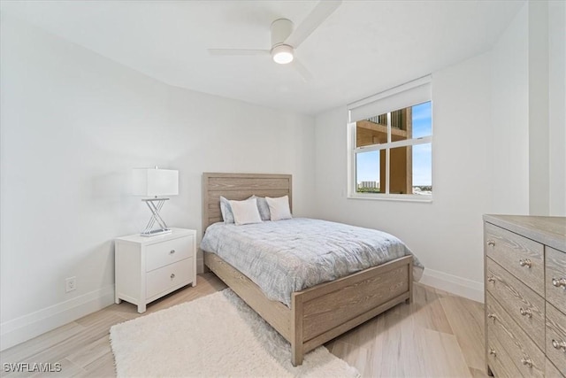 980 Cape Marco Dr Unit 805, Marco Island, FL 34145 - bedroom with baseboards, light wood finished floors, and a ceiling fan