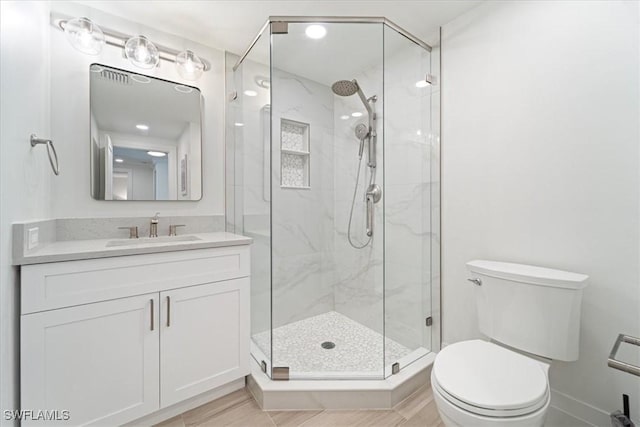 980 Cape Marco Dr Unit 805, Marco Island, FL 34145 - bathroom featuring a marble finish shower, toilet, vanity, and baseboards