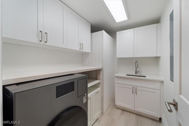 980 Cape Marco Dr Unit 805, Marco Island, FL 34145 - laundry room featuring cabinet space and light wood-style floors