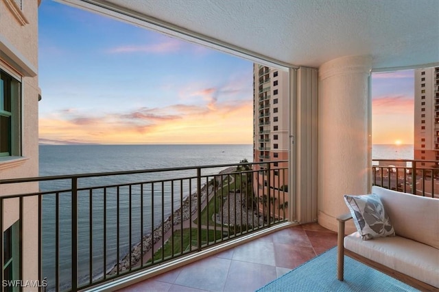 980 Cape Marco Dr Unit 805, Marco Island, FL 34145 - balcony at dusk featuring a water view