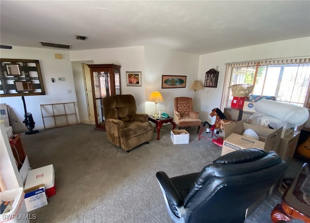 living room with carpet and visible vents