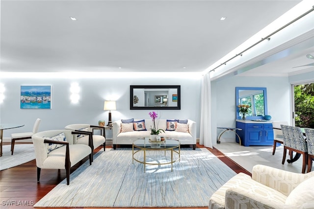 living area with light wood finished floors and crown molding