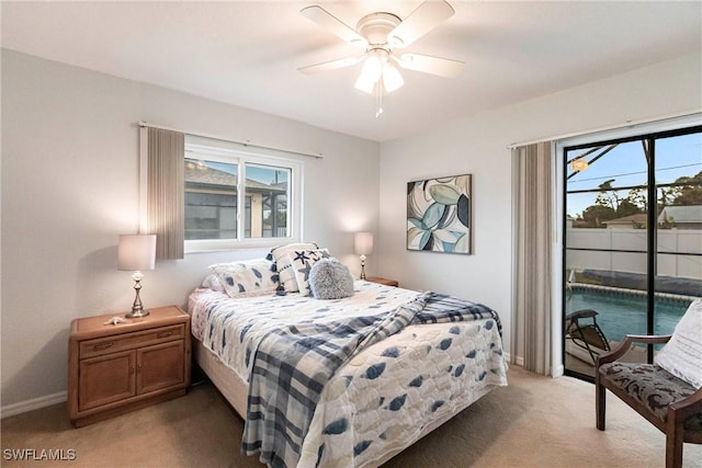 bedroom featuring access to exterior, light carpet, baseboards, and a ceiling fan