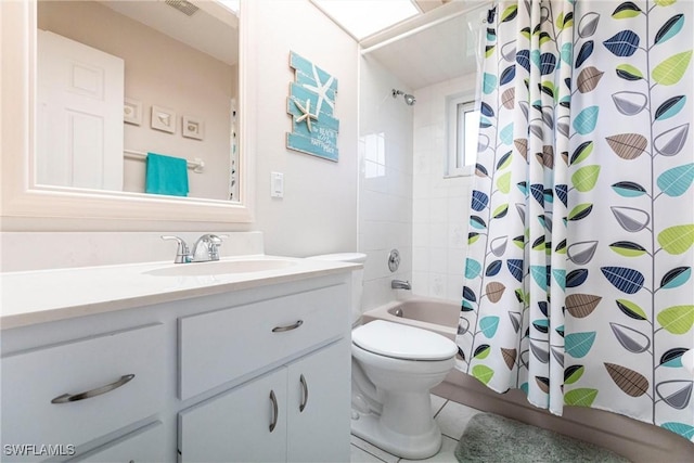 bathroom with toilet, shower / bath combo with shower curtain, and vanity