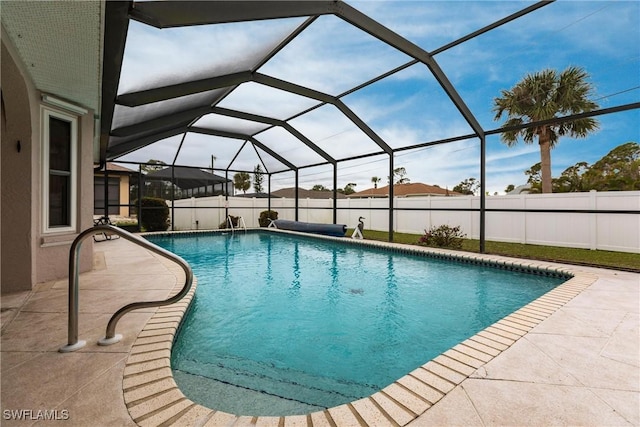 view of swimming pool featuring a fenced in pool, a lanai, a patio area, and a fenced backyard