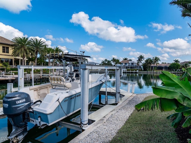 view of dock featuring a water view and boat lift