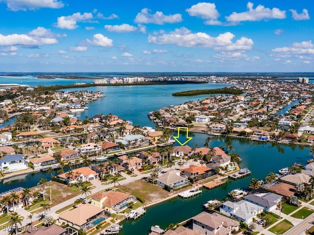 bird's eye view featuring a water view and a residential view