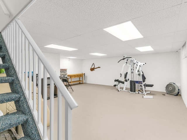 workout area with a paneled ceiling