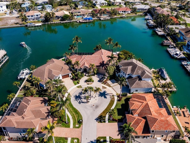 bird's eye view with a residential view and a water view