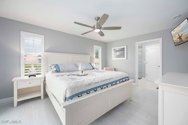 bedroom featuring ceiling fan and baseboards