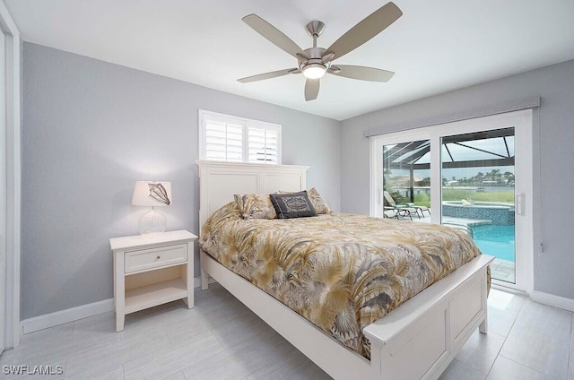 bedroom featuring access to outside, a ceiling fan, a sunroom, and baseboards