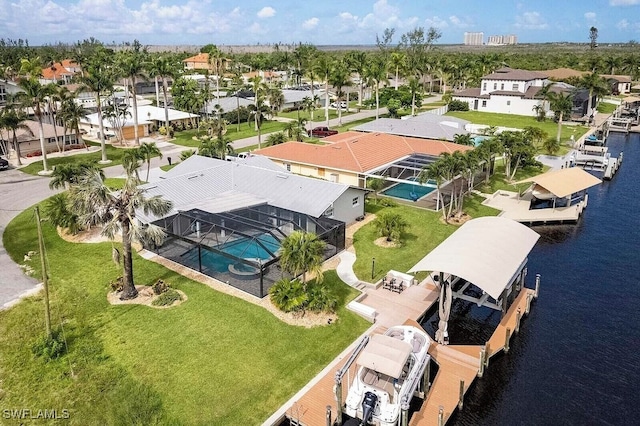 bird's eye view featuring a residential view and a water view