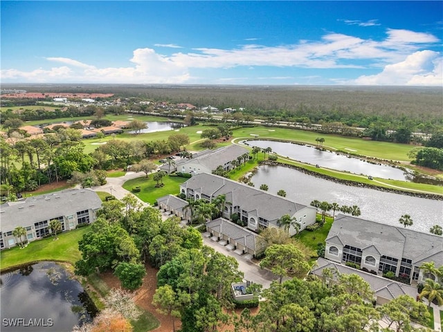 aerial view with view of golf course and a water view