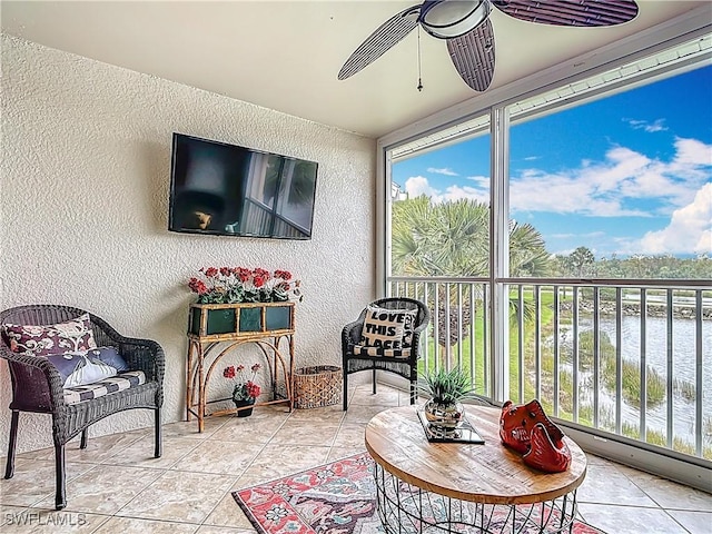 sunroom with ceiling fan and a healthy amount of sunlight