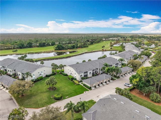 aerial view with golf course view, a water view, and a residential view