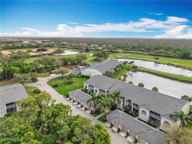 aerial view featuring a water view and view of golf course