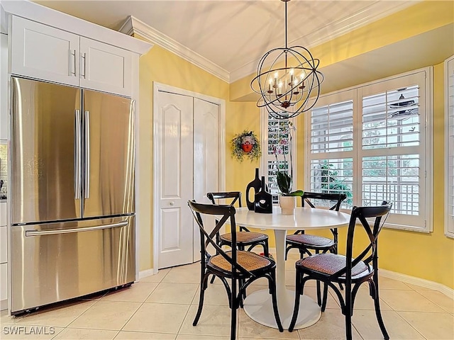 dining space with a notable chandelier, crown molding, baseboards, and light tile patterned floors