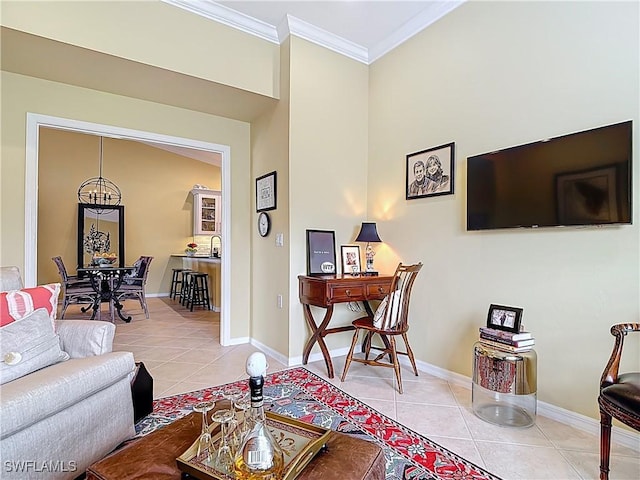 living area featuring light tile patterned floors, baseboards, and crown molding