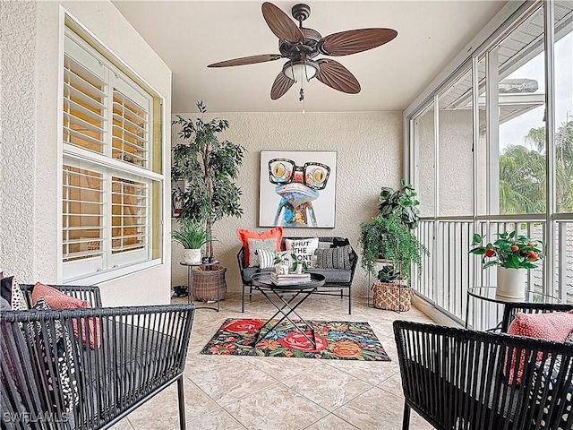 sunroom with ceiling fan