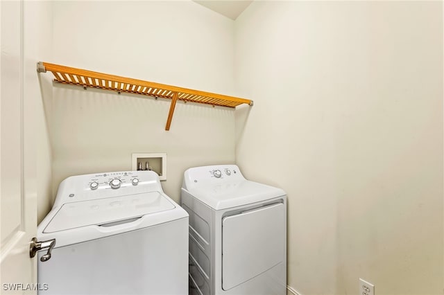 laundry room with washing machine and dryer and laundry area