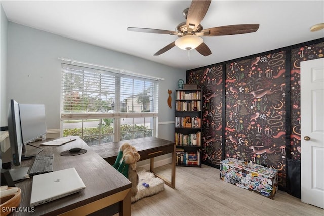 office space featuring light wood finished floors and ceiling fan