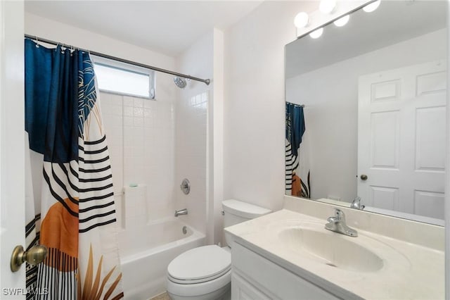 bathroom featuring vanity, toilet, and shower / bath combo with shower curtain