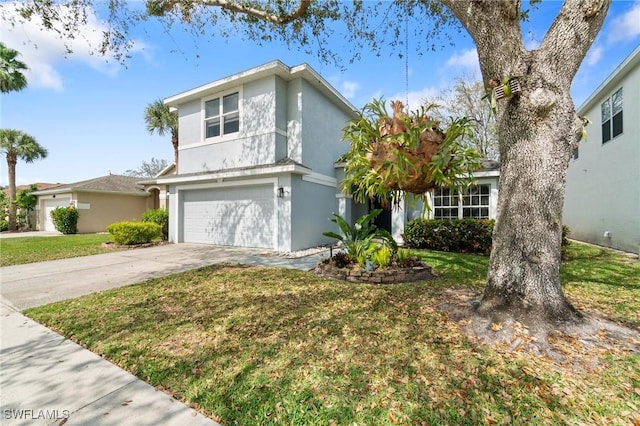 view of front of home with an attached garage, driveway, a front lawn, and stucco siding