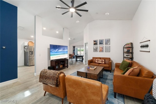 living area with baseboards, a ceiling fan, lofted ceiling, light wood-style flooring, and recessed lighting