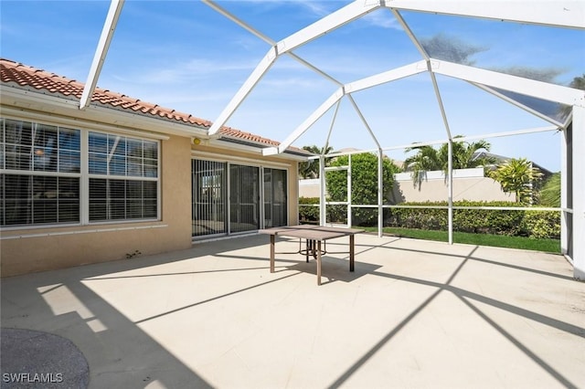 view of patio / terrace featuring a lanai