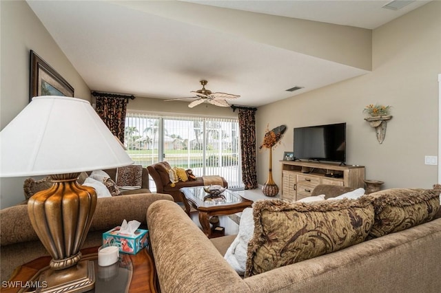 living area featuring ceiling fan, wood finished floors, and visible vents