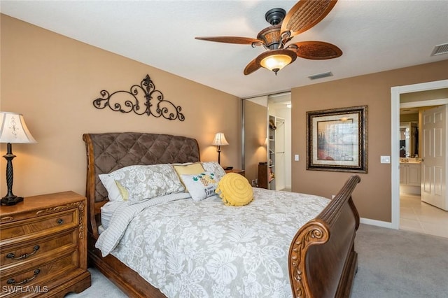 bedroom with light carpet, visible vents, baseboards, a ceiling fan, and a closet