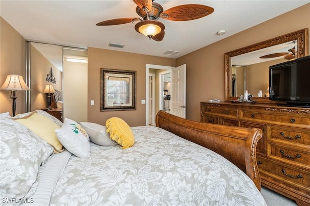 bedroom with ceiling fan and visible vents