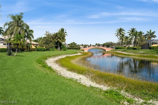 exterior space with a yard and a water view