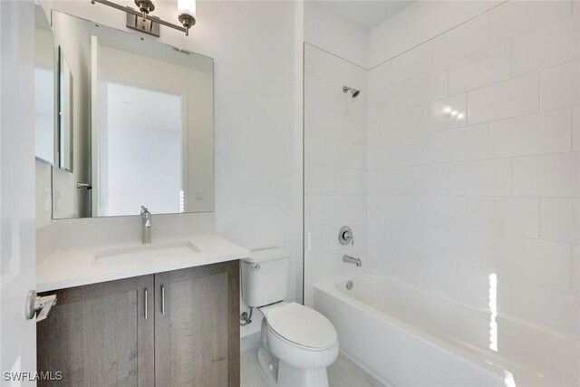 full bath with tub / shower combination, toilet, and vanity