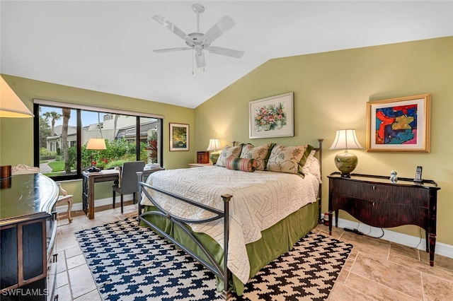 bedroom with ceiling fan, baseboards, and vaulted ceiling