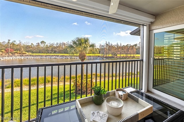 balcony featuring a water view