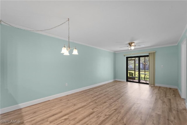 unfurnished room featuring ceiling fan with notable chandelier, light wood-type flooring, baseboards, and ornamental molding