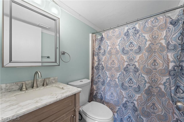 bathroom featuring vanity, crown molding, toilet, and a shower with curtain