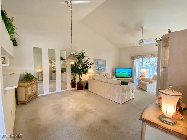 living room with light carpet, ceiling fan, and high vaulted ceiling