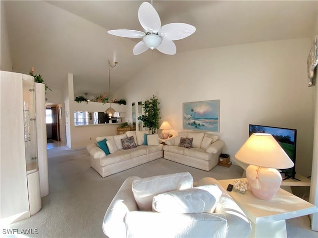 living area featuring light carpet, lofted ceiling, and a ceiling fan