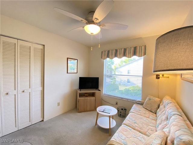 living room with carpet and ceiling fan