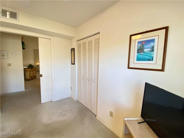 bedroom with a closet and visible vents