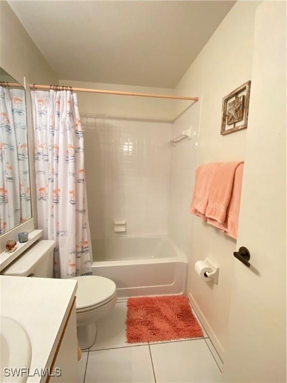 bathroom with toilet, tile patterned flooring, shower / bath combo, and vanity