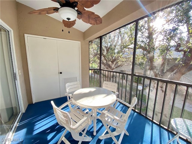 sunroom with visible vents, vaulted ceiling, and a ceiling fan