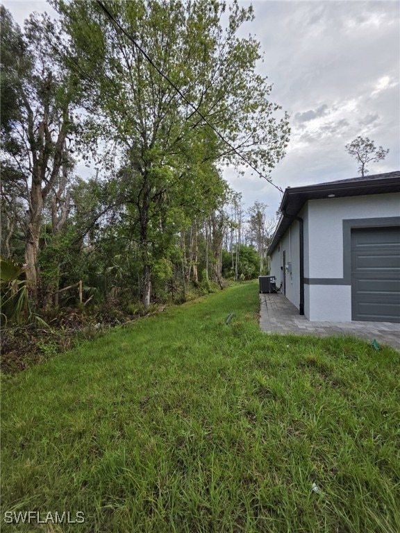 view of yard with central AC