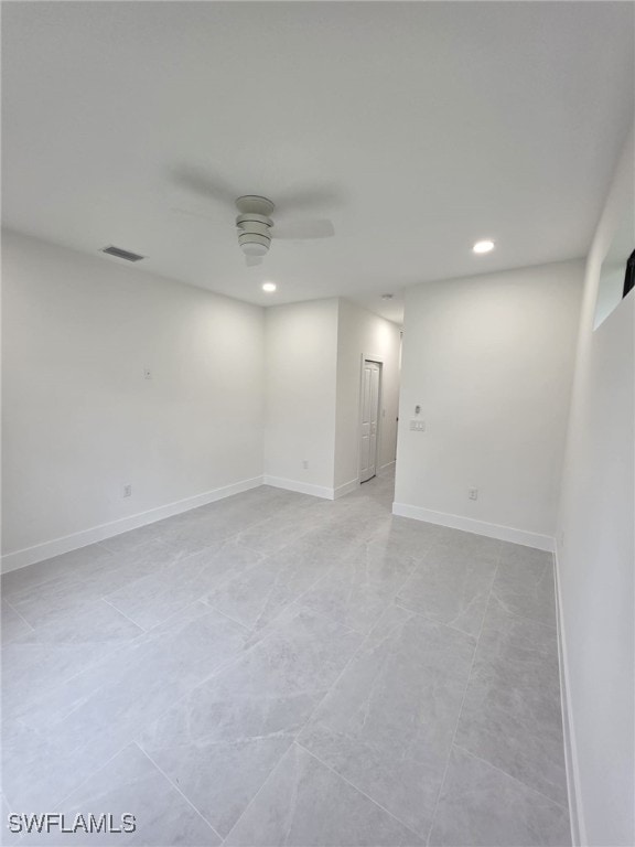 spare room with a ceiling fan, recessed lighting, visible vents, and baseboards