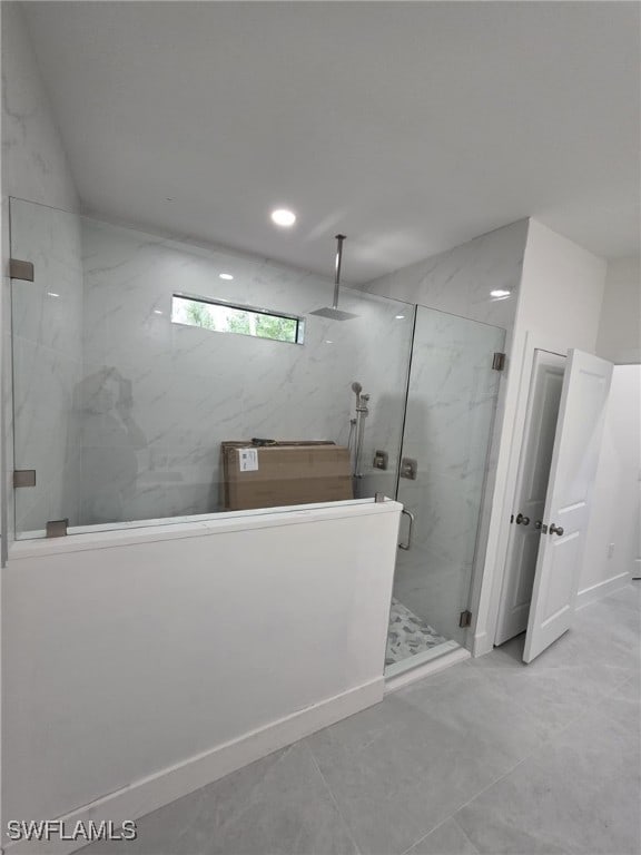 full bathroom with a marble finish shower and recessed lighting