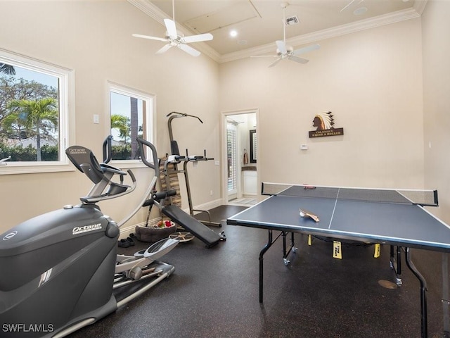 game room featuring a ceiling fan, visible vents, ornamental molding, and baseboards