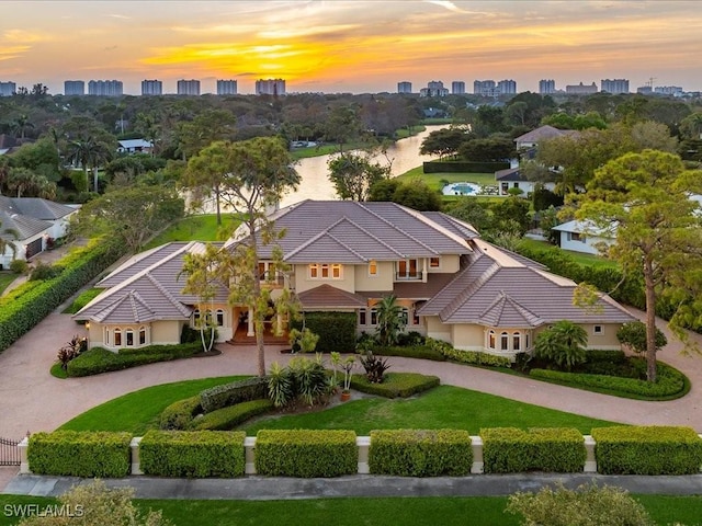 bird's eye view featuring a water view and a city view